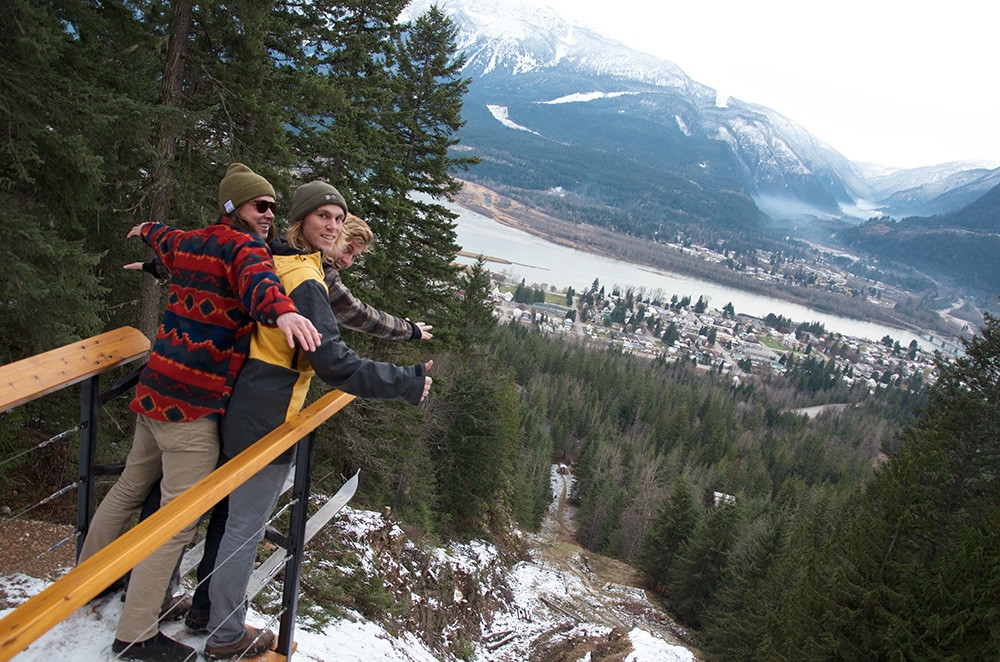 Friends (from left) Kent Christensen, Will Combaluzier, and Will Millar ham it up atop the new ski jump sculpture and platform in the Nels Nelsen Recreation Area in Mount Revelstoke National Park. Photo: Aaron Orlando/Revelstoke Mountaineer