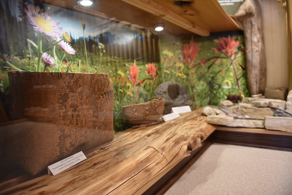 Baskets, a rock bowl, and other artifacts at the ne Revelstoke Museum & Archives Sinixt display. Photo: Aaron Orlando/Revelstoke Mountaineer