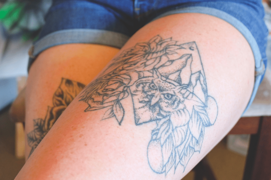 Meagan's body is also a canvas, the artist rocks four delicate hand drawn tattoos of her own making across both legs. Photo: Sarah j Spurr